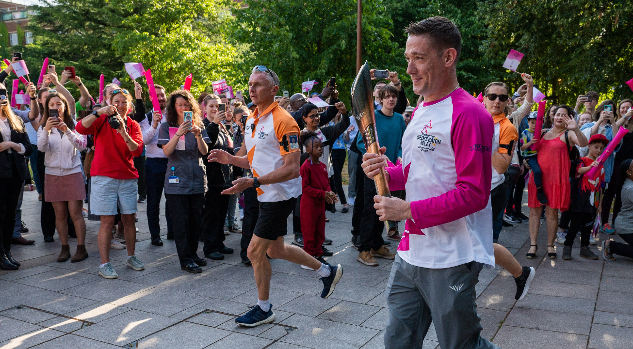 Luke Trainor holding the baton during the Queen's Baton Relay for the Birmingham 2022 Commonwealth Games.