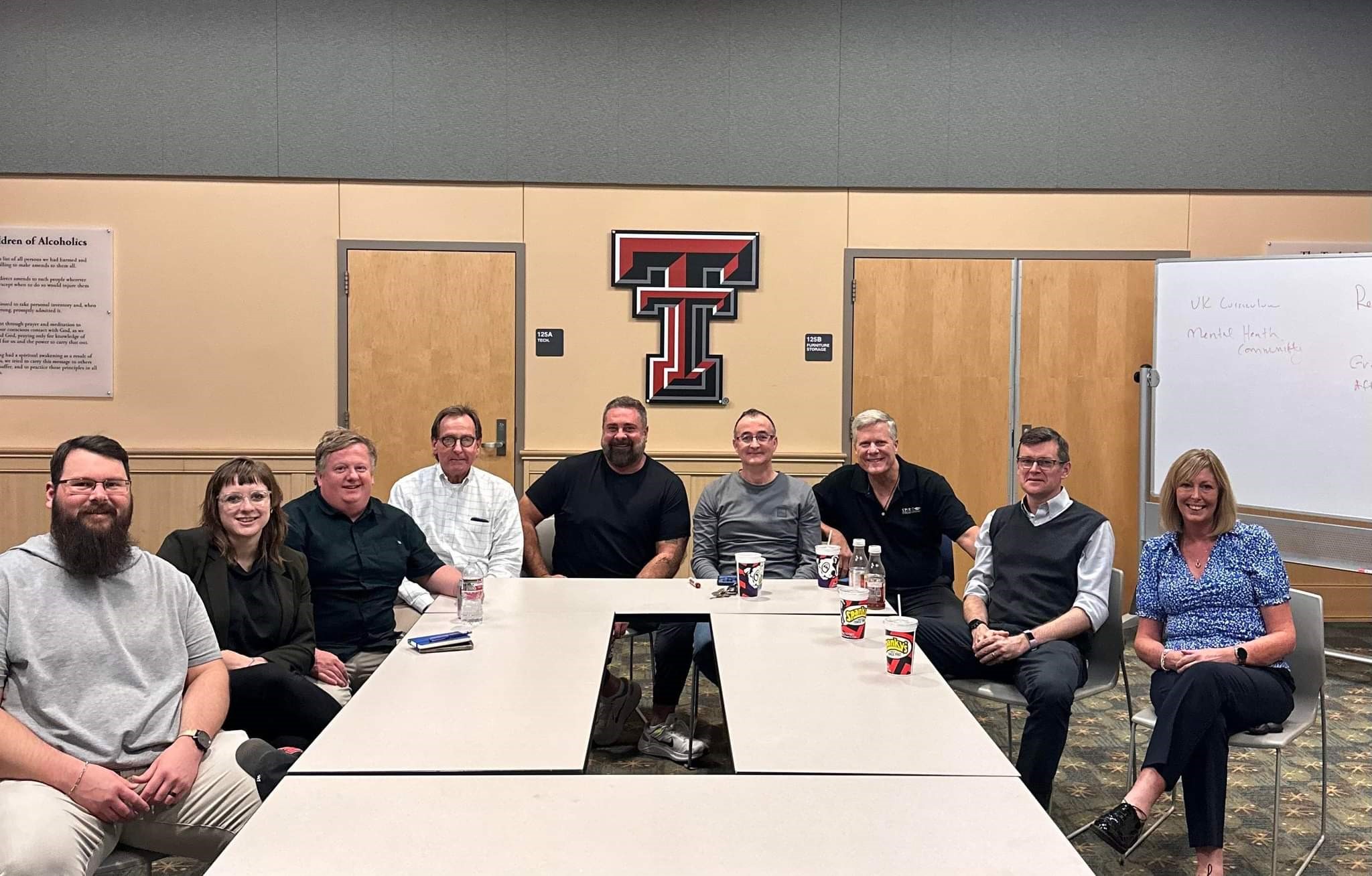 Vince Sanchez, Professor Tom Kimball, Professor George Comiskey and students from Texas Tech University gathered together.